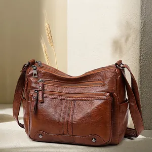 Retro brown soft leather crossbody bag with multiple zip pockets and adjustable strap