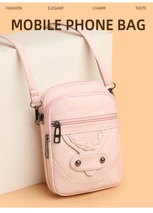 Pink faux leather mobile phone bag with woven texture, metal studs and zipper detail