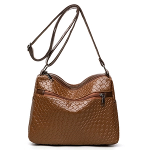 Brown woven leather crossbody bag for women with multiple zippers and adjustable strap
