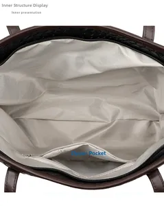 Detail view of the vintage tote bag interior featuring gray lining and a zipper pocket