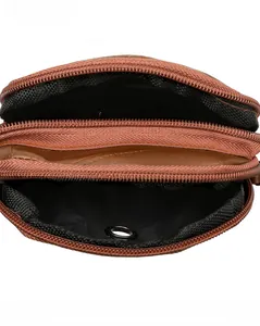 Top view of brown lychee leather bag showing dual main compartments and black mesh interior