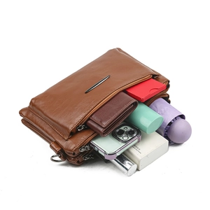 Brown multi-layer faux leather crossbody bag with spacious compartments for essentials