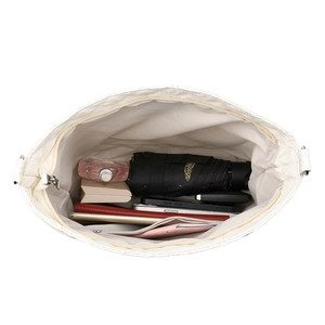 Quilted white shoulder bag with spacious interior and zipper pocket for daily items