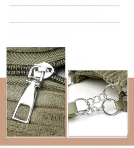 Detail of high-quality silver plated chain strap and metallic zipper on green tote bag