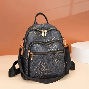 Retro Chinese style backpack featuring golden wave patterns and gold hardware on dark leather