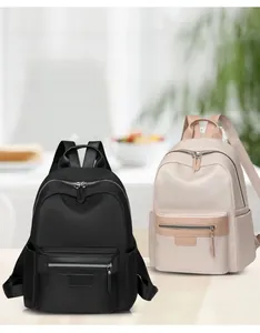 Lightweight nylon backpack in black and beige showing large capacity and multiple pockets