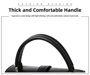 Close-up of the ergonomic rounded handle and gold hardware on a woven black handbag