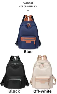 Three minimalist nylon backpacks in blue, black, and cream white displayed on white background
