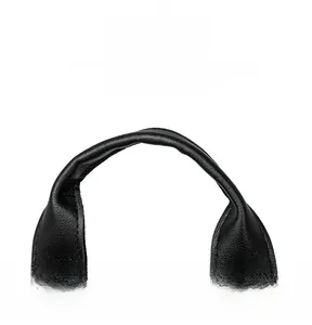 Close-up of the black nylon travel backpack showing a comfortable faux-leather top handle