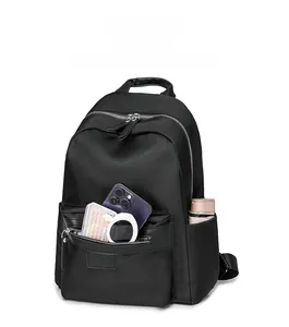 Detail view of large capacity nylon travel backpack with front zipper and side bottle pockets