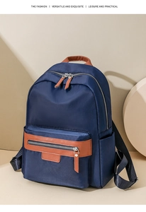 Detail view of large capacity nylon backpack with brown accents for travel and commuting