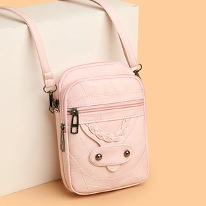 Pink faux leather crossbody phone bag with multi-zipper layers and woven smile detail