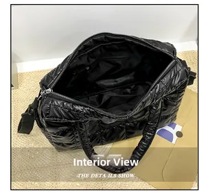 Detailed interior of black quilted tote showing multifunctional pockets and lining