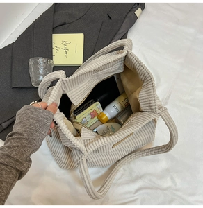 Detail view of large corduroy tote bag interior showing spacious capacity and inner pocket