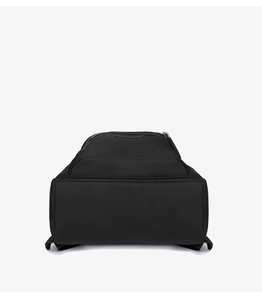 Detailed bottom view of large black nylon backpack with reinforced stitching for commuting