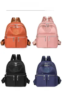 Gitteransicht der Nylon-Rucksäcke in Orange Rosa Schwarz und Blau mit Kleeblatt-Logo