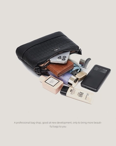 Top view of three-compartment crossbody bag showing large internal storage capacity