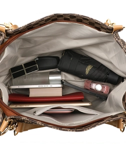 Top view detail of a spacious tote bag interior showing large storage capacity and inner pocket