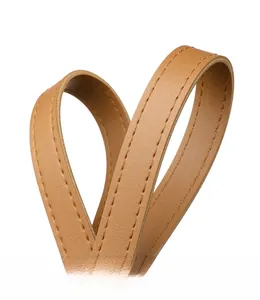 Detailed macro view of caramel leather tote handle with precision double stitching