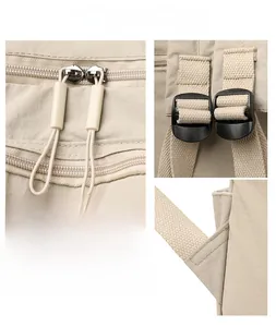Detail of durable Oxford fabric backpack showing double zippers and reinforced straps
