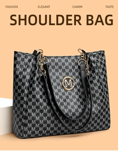 Macro detail of tote bag showing monogram print with gold chain and metal M logo
