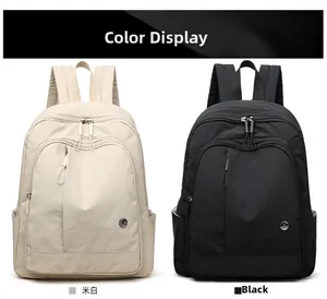 Detailed comparison of minimalist oxford fabric backpacks in cream white and black finishes