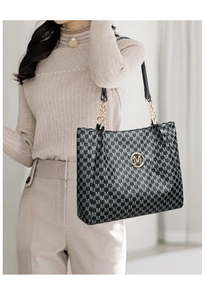 Detail of black tote bag featuring gold M logo and chain strap with vintage pattern