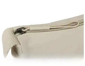 Close-up of smooth beige nylon zipper detail on casual crossbody bag with comfortable grip