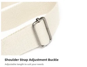Detail of adjustable canvas shoulder strap with dark grey rectangular metal buckle