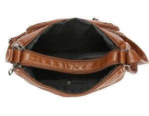 Top view of spacious brown faux leather crossbody bag showing multi-pocket interior