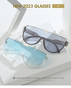 Close-up of semi-rimless oversized sunglasses with light blue and smoke grey transparent lenses