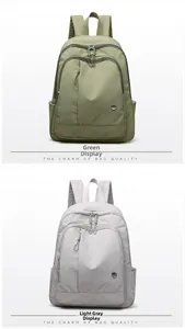 Detailed view of lightweight nylon backpacks in olive green and light gray variants