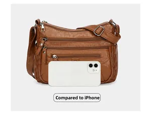 Brown soft leather multi-pocket crossbody bag size comparison with an iPhone