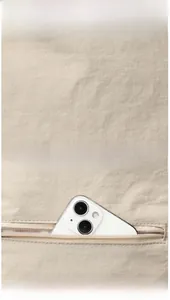 Detail of water-resistant oxford fabric and back anti-theft zipper pocket for smartphone