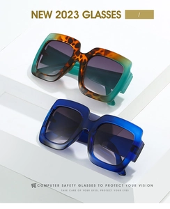 Detail of square two-tone sunglasses in teal tortoise and translucent blue frames