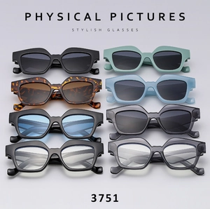 Flat lay of multiple stylish oversized sunglasses in various colors and lens finishes