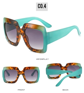 Detail view of square tortoiseshell frame sunglasses with gradient purple lenses and blue temples