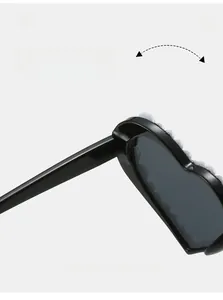 Détail macro d'une charnière en métal sur des lunettes de soleil cœur de luxe