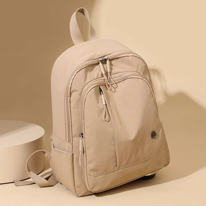 Minimalist beige nylon backpack with large capacity for daily commute and travel