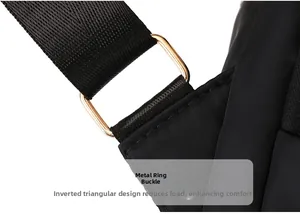 Detail of light gold square metal buckle and reinforced stitching on black backpack strap
