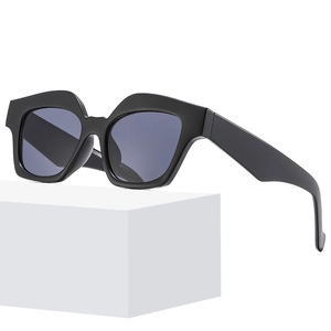 Minimalist square black geometric sunglasses with thick frames and dark smoke lenses