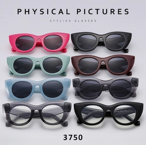 Flat lay of stylish cat eye sunglasses in multiple vibrant colors and thick frames