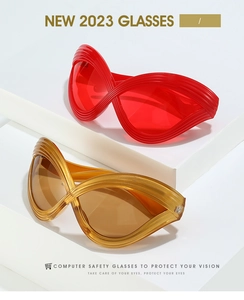 Detail of infinity frame sunglasses with sleek linear texture in red and amber