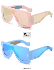 Detailed 45-degree angle view of futuristic oversized shield sunglasses in pink and blue