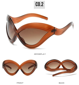 Three-way view of futuristic cat-eye sunglasses with twisted frame and gradient lenses
