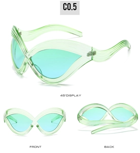 Detail of light green butterfly sunglasses with wavy texture and gradient lenses