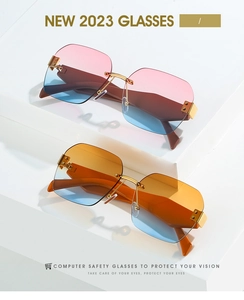 Detail einer randlosen quadratischen Sonnenbrille mit rosa und orangefarbenen Verläufen