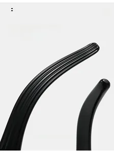 Detail of ergonomic black sunglasses arms with non-slip textured striped design