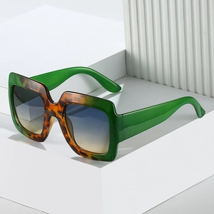 Green and tortoise shell square oversized sunglasses with blue gradient lenses
