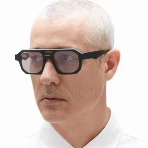 Side view of square double-bridge sunglasses with thick black frames and purple lenses